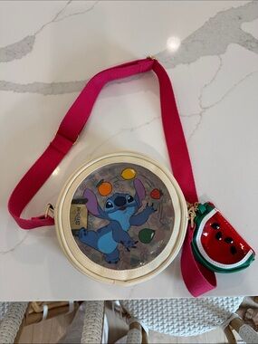 Disney Bioworld Stitch Round Crossbody Bag with bag charm.